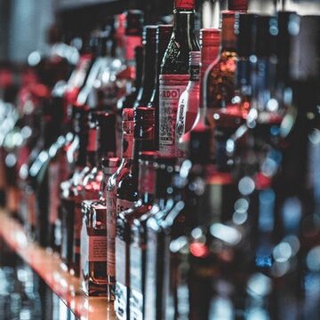 selective-focus-photo-of-alcohol-bottles-3355400